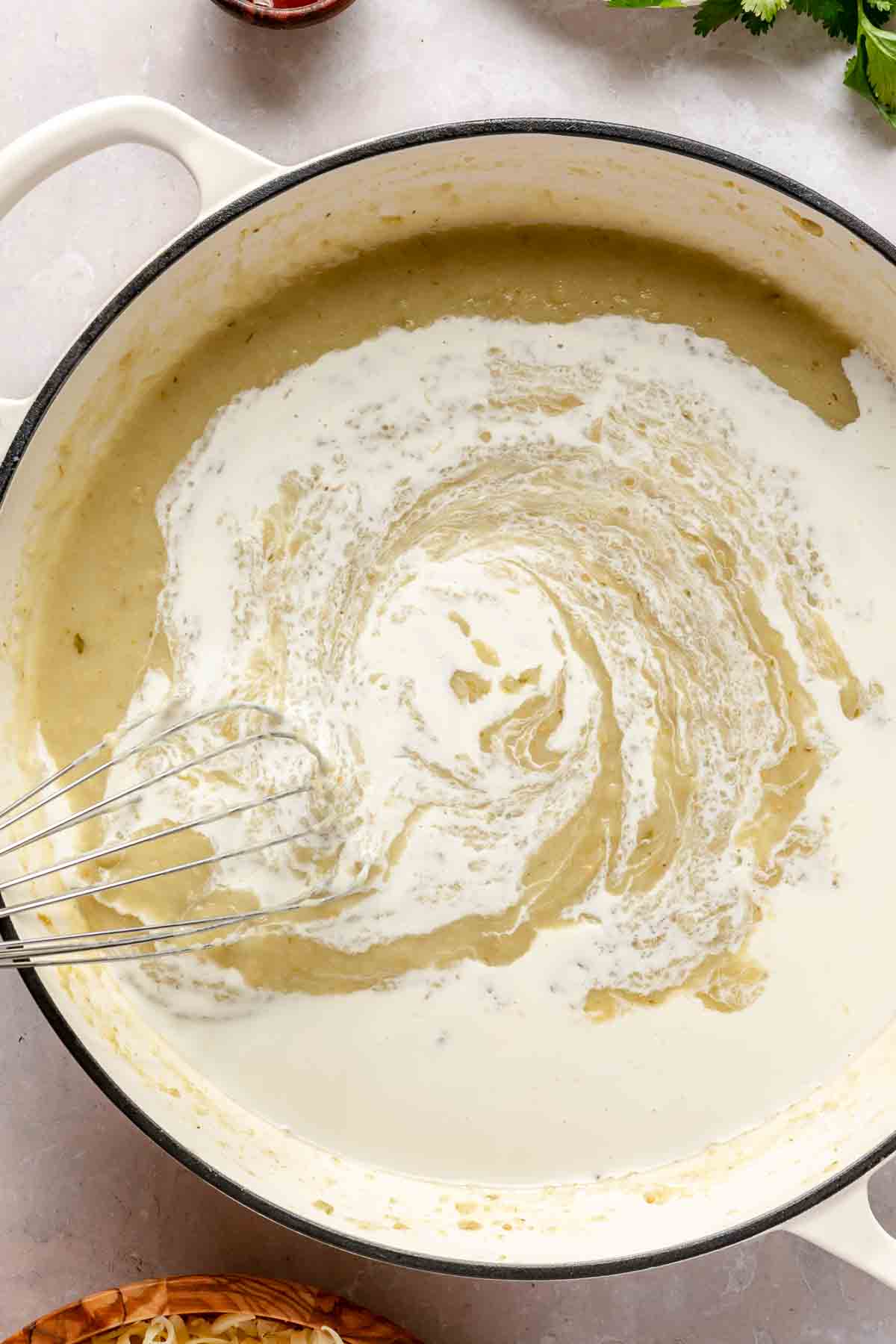 Whisk cream into sauce.