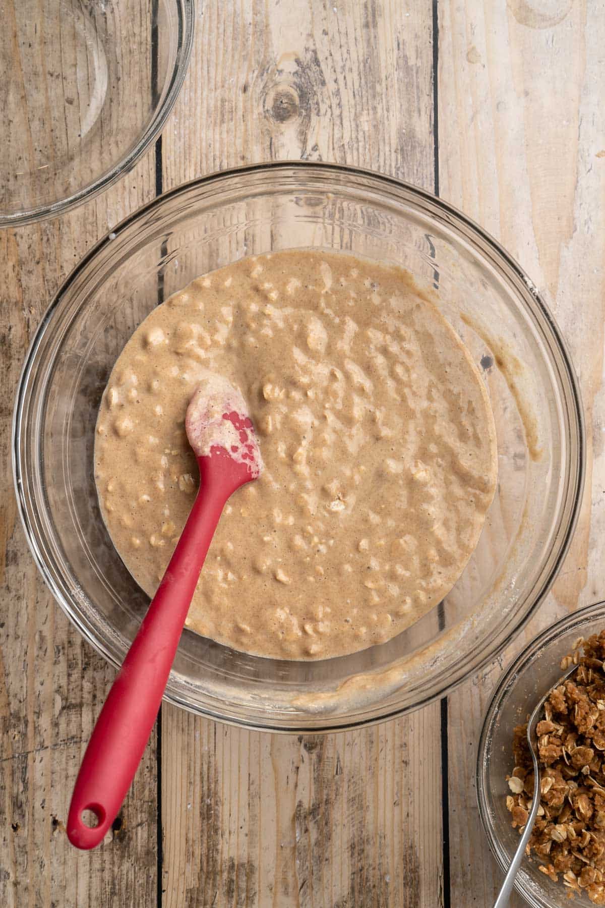 Stirring the wet mixture with the flour mixture in a large mixing bowl.