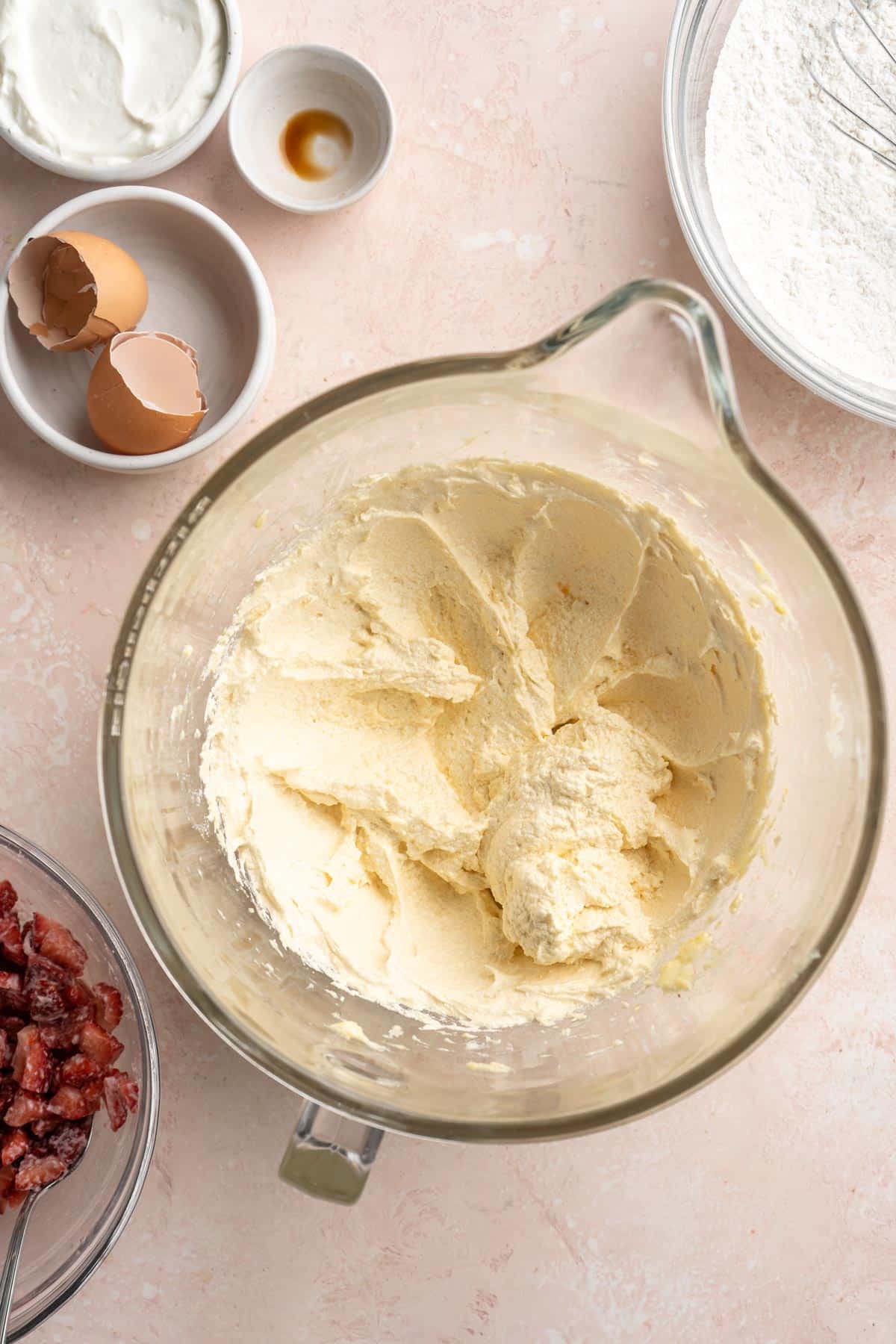 Batter mixture in a glass mixing bowl.