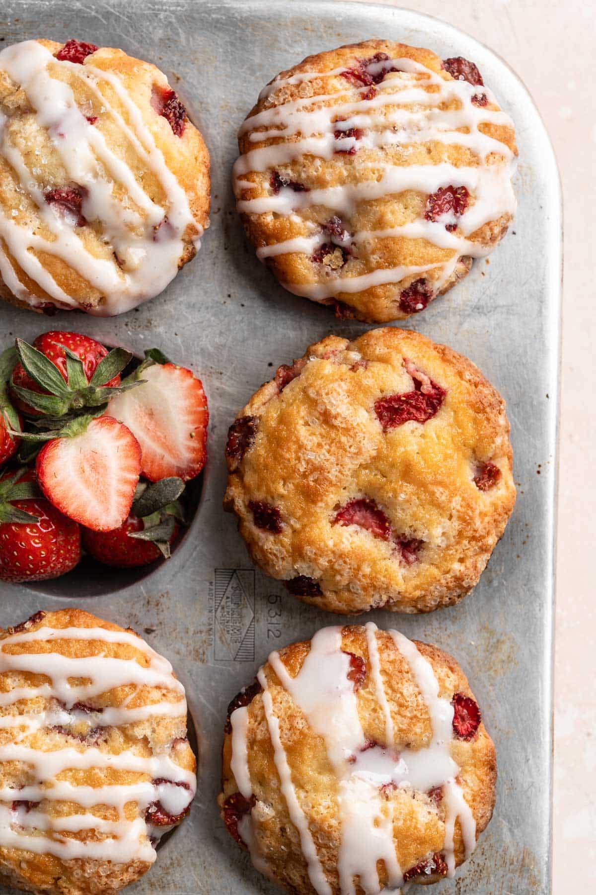 Top view of strawberry muffins in a muffin pan.