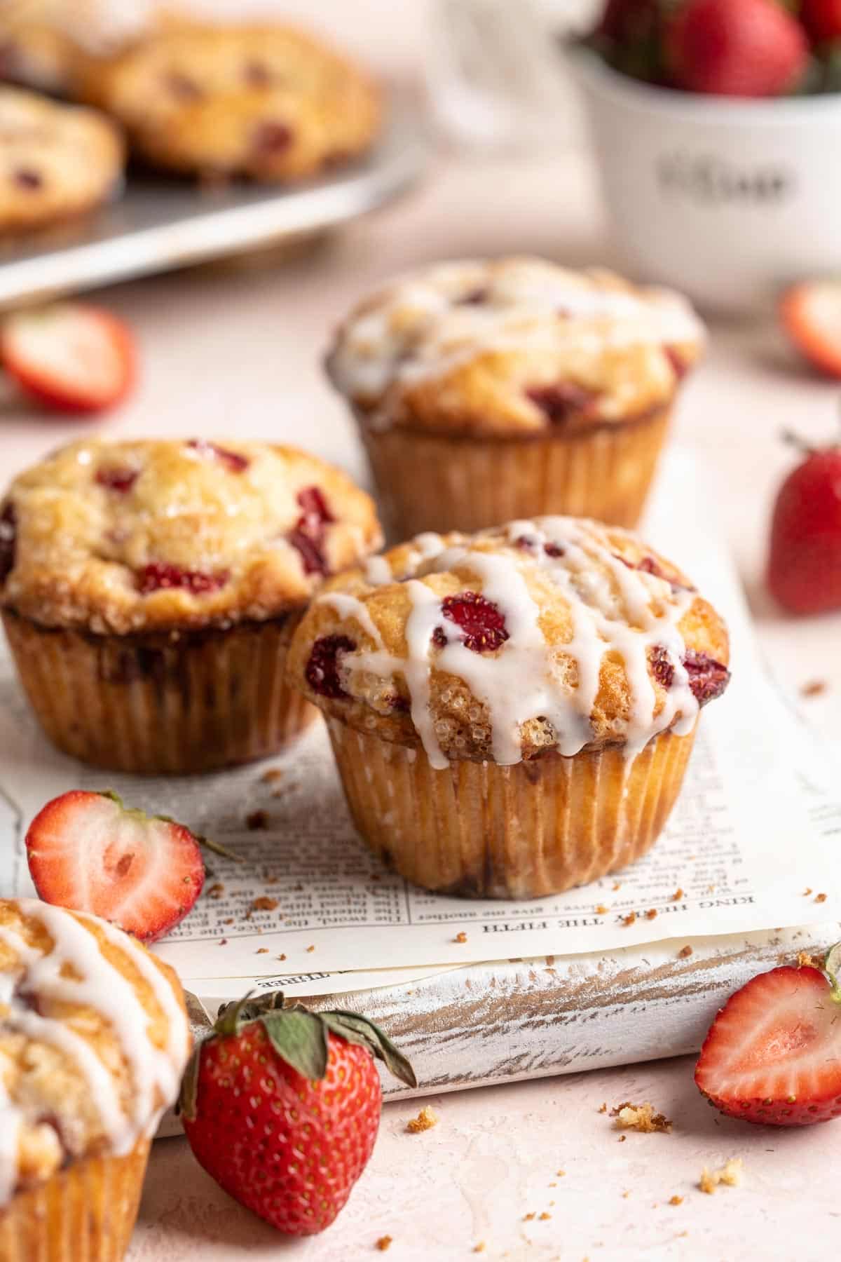 Strawberry muffins drizzled with glaze.