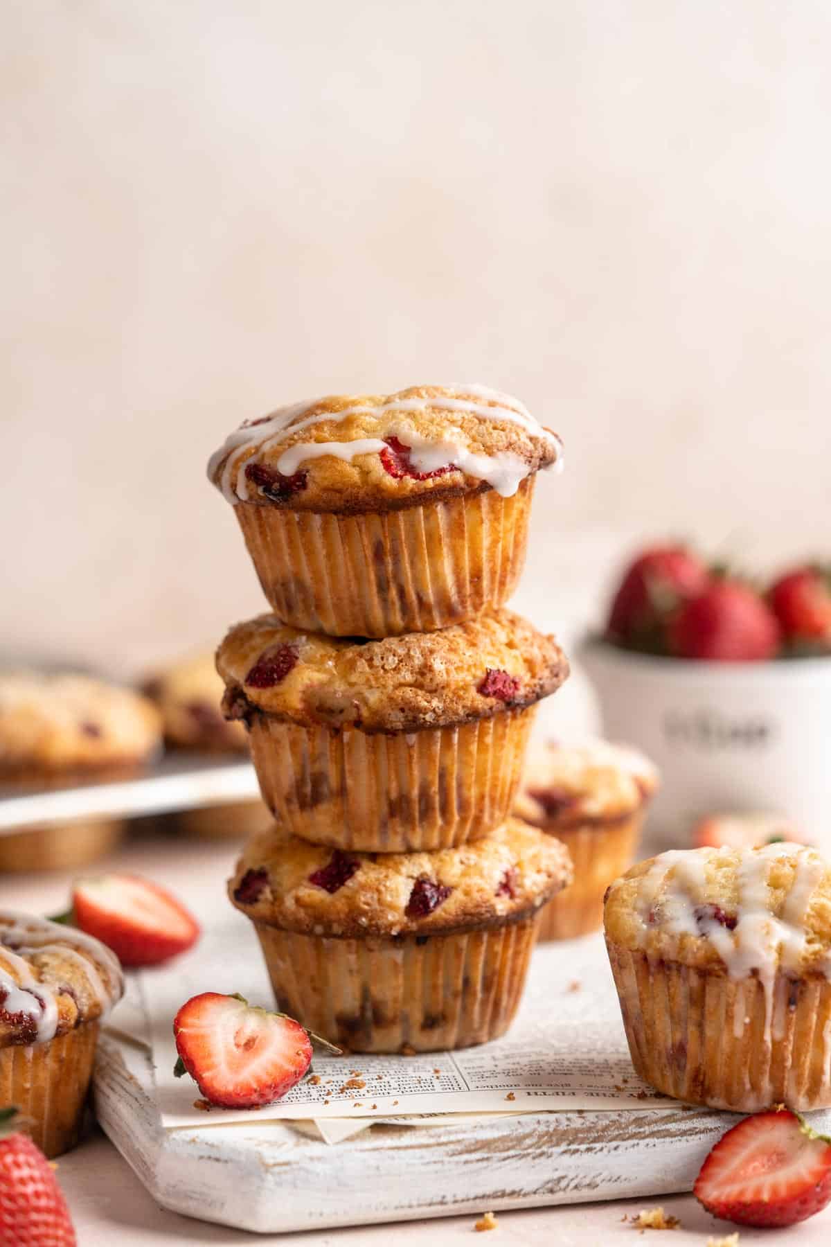 Strawberry muffins stacked one on top of another.