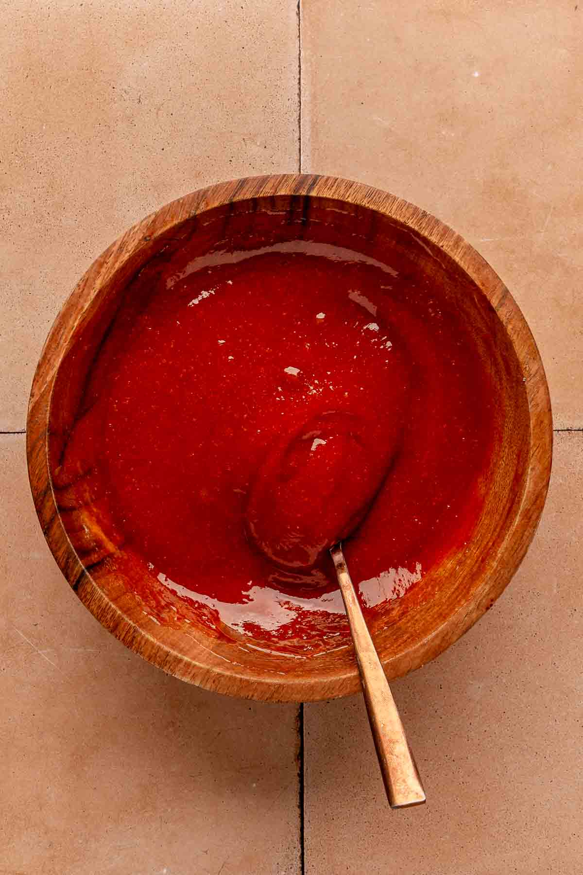 Stirring together ketchup, brown sugar and dijon mustard in a small bowl.