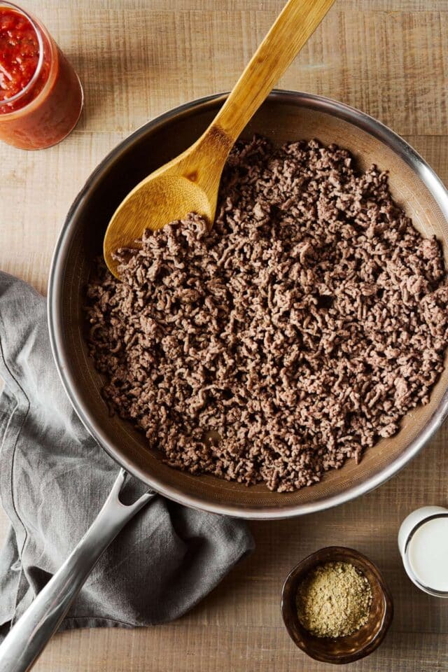 Browning ground beef in a skillet.