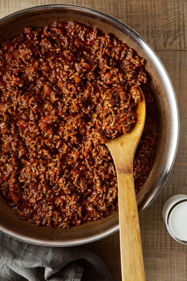 Seasoned ground beef in a pan.