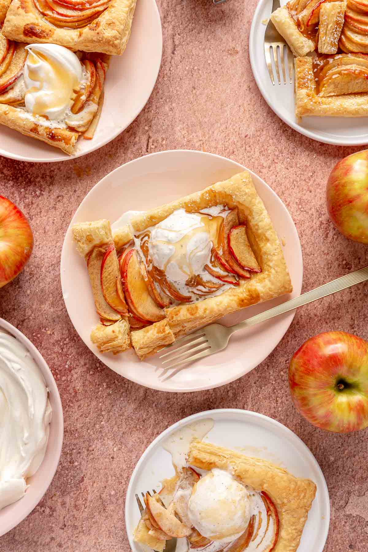 Puff pastry tarts served on plates with scoops of ice cream.