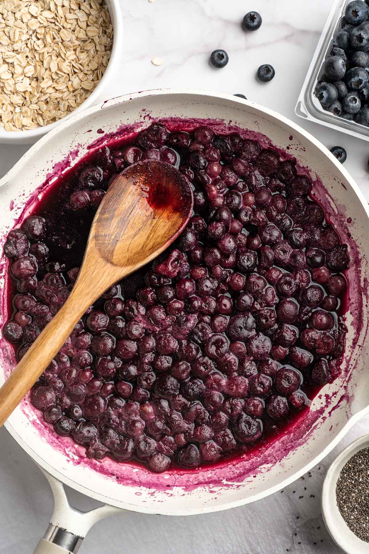 Blueberries cooking in a large pot.