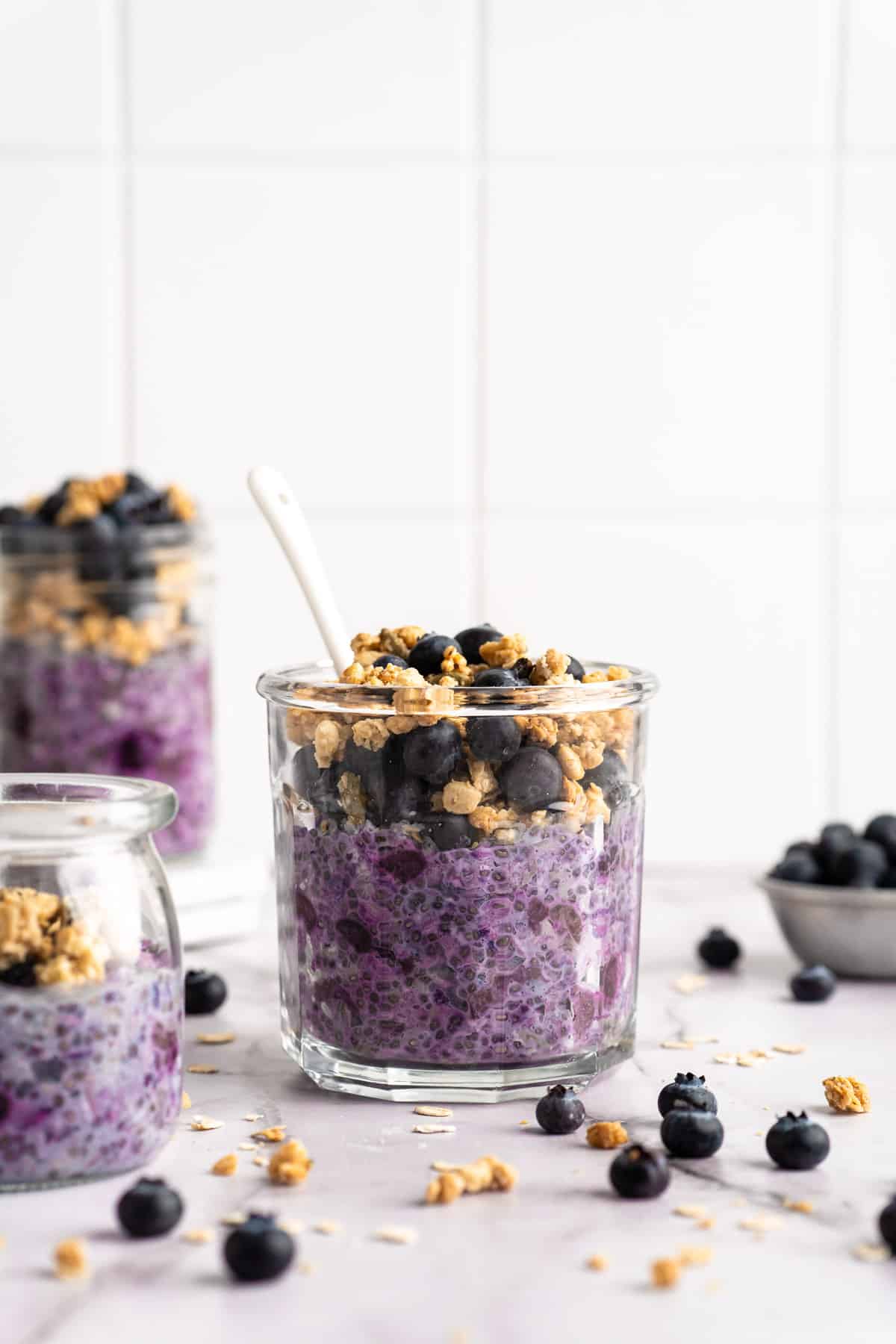 Blueberry overnight oats topped with granola and fresh blueberries.