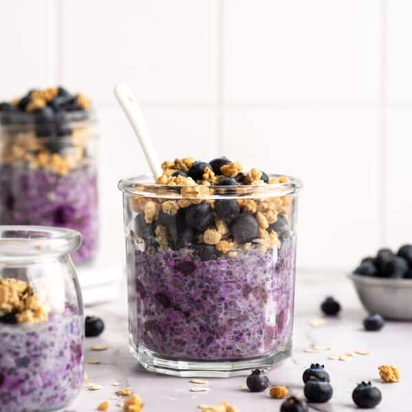 Blueberry overnight oats topped with granola and fresh blueberries.