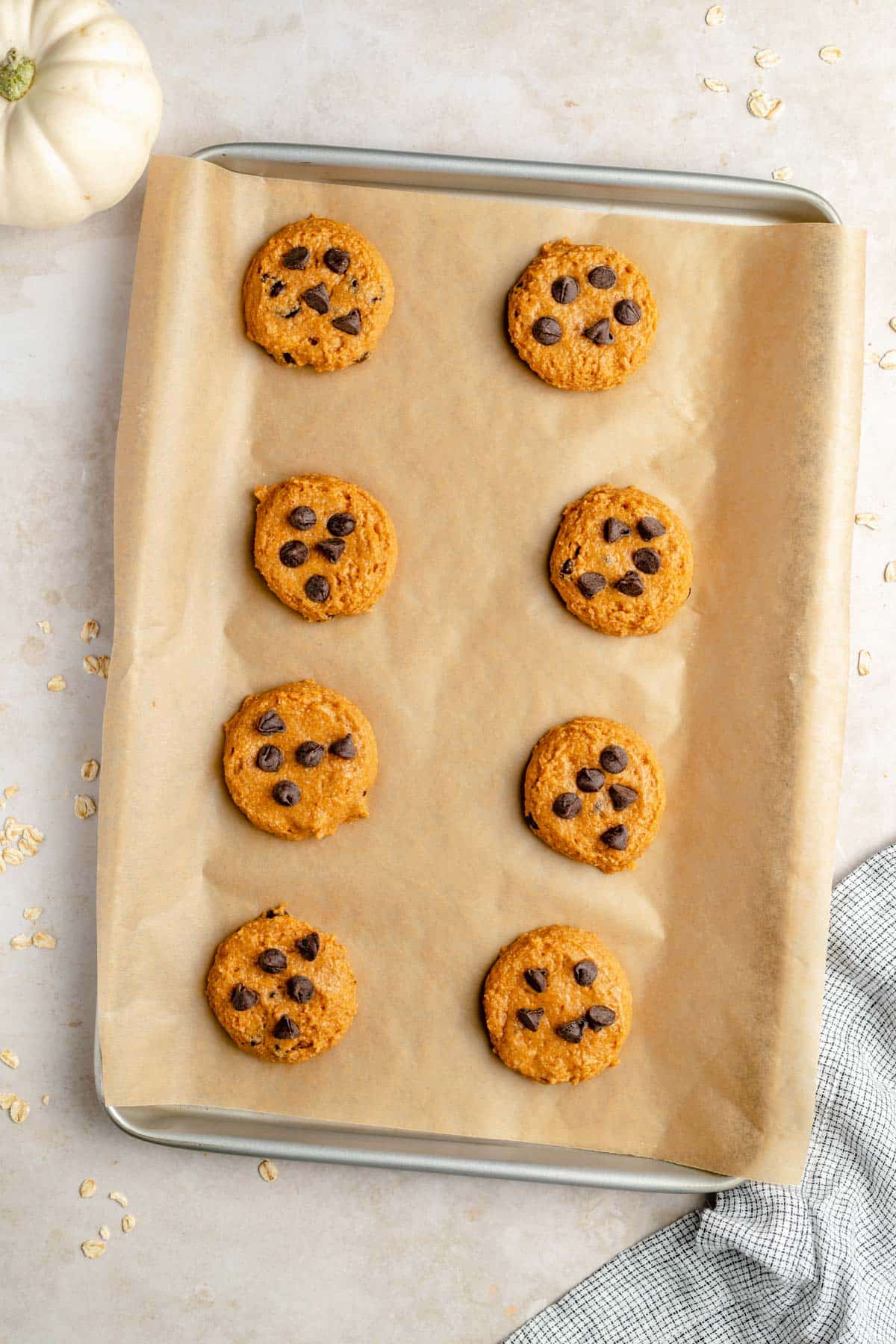 healthy pumpkin cookie on a parchment-lined baking sheet