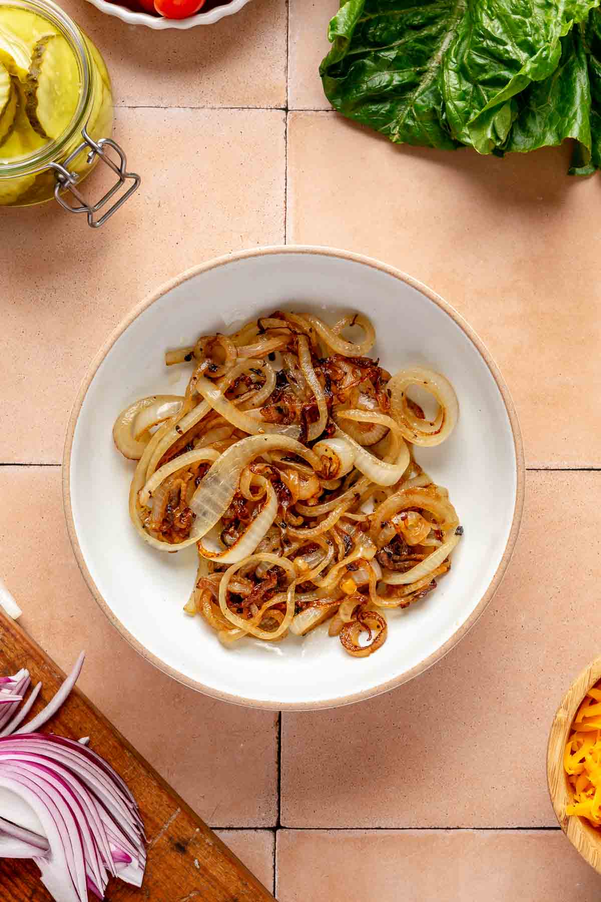 Caramelized onions in a small white bowl.