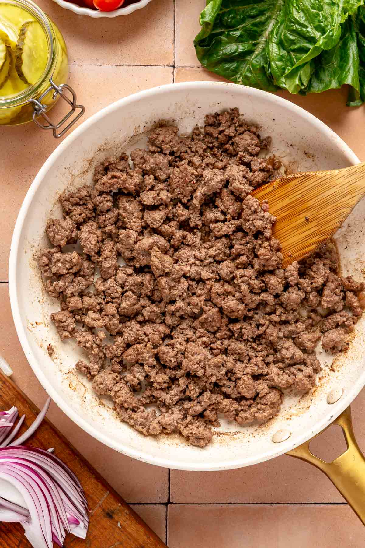 Browning ground beef in a skillet.