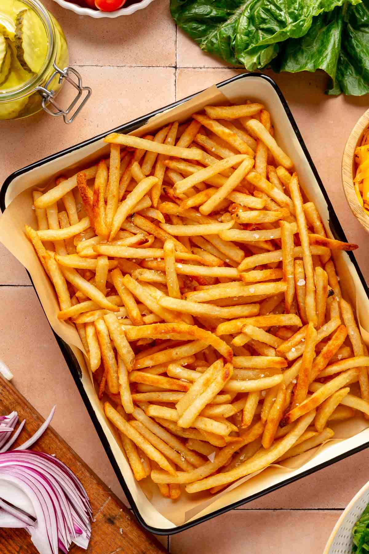 Baked French fries on a serving platter.