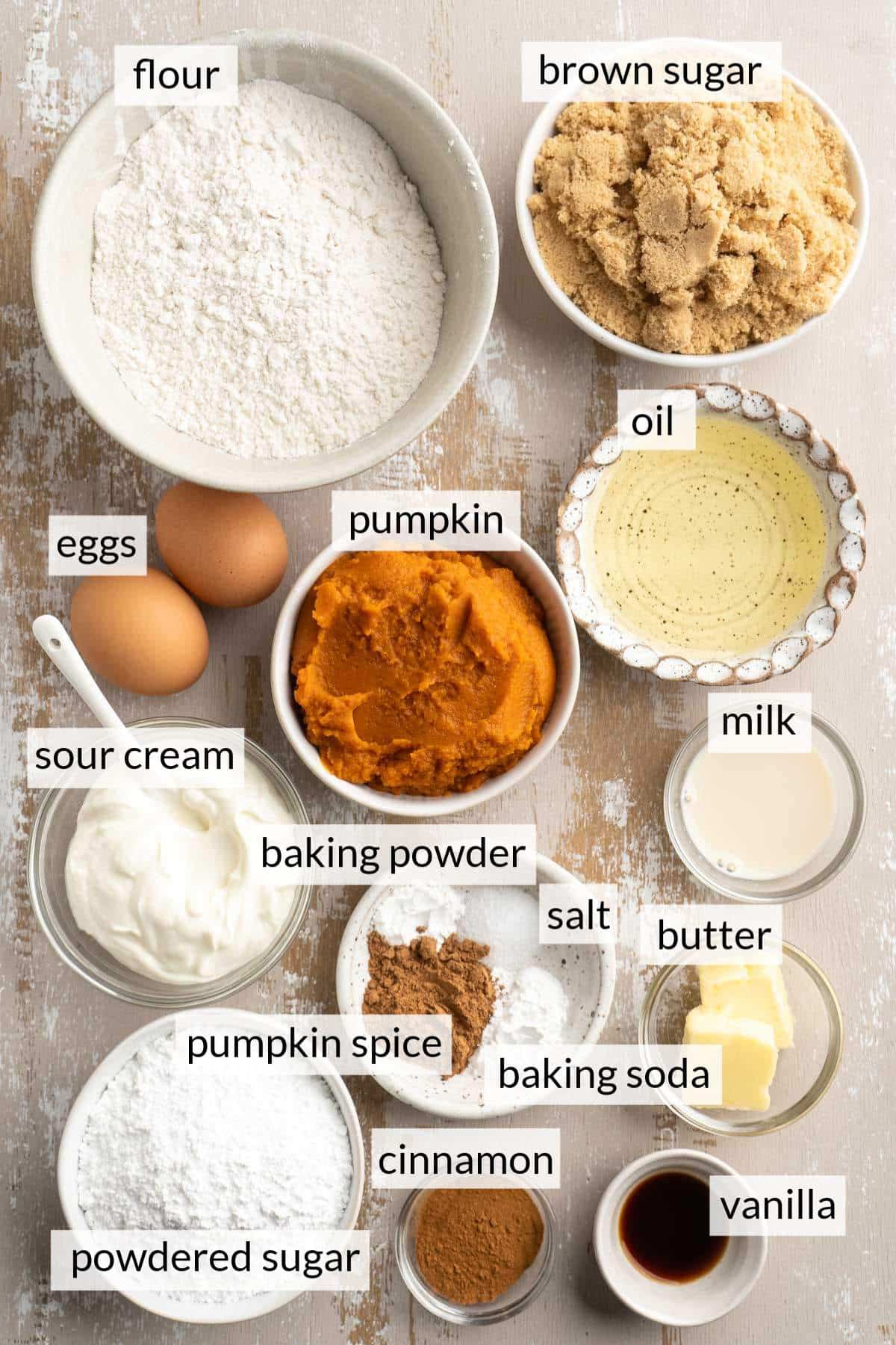 Bowls with flour, brown sugar, pumpkin, oil, yogurt, cinnamon and vanilla.