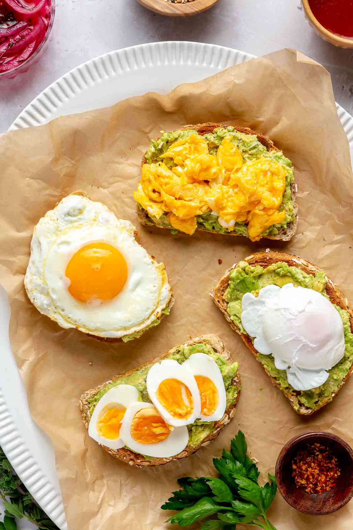 Egg cooked 4 different ways served over avocado toast.