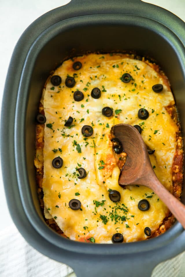 Healthy, easy 5 Ingredient Slow Cooker Taco Bake. Just set it and forget it for a cheesy, protein-packed meal the whole family will love! 