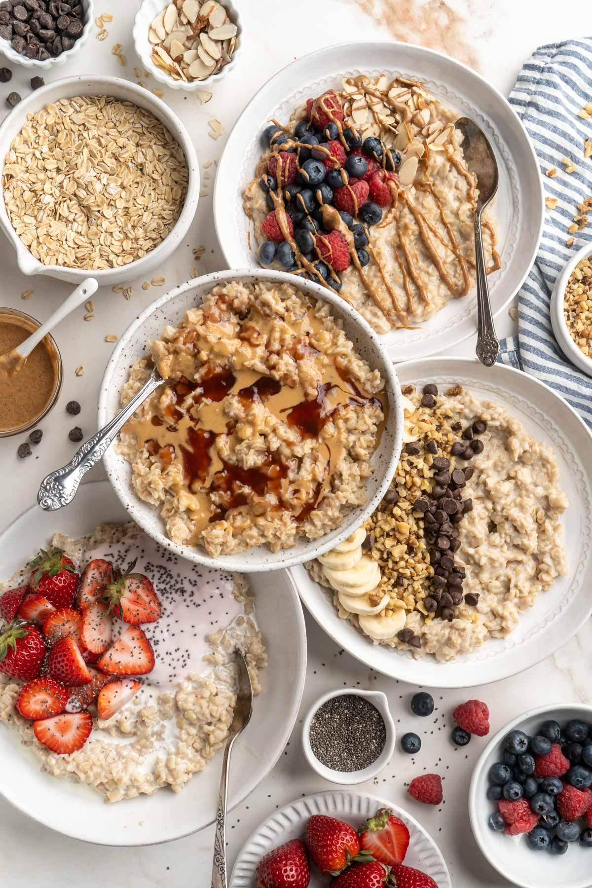 Bowls of oatmeal with different toppings.