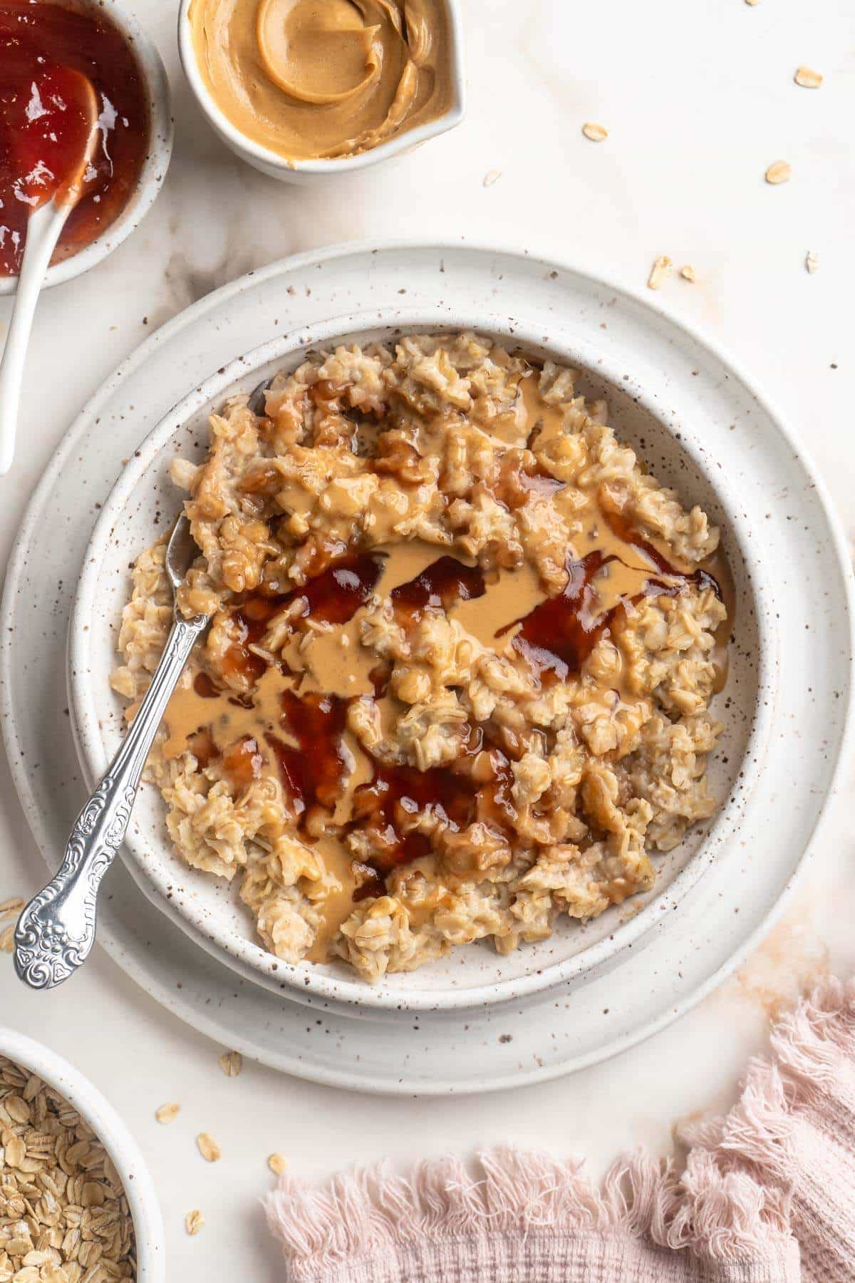 Oatmeal topped with peanut butter and jelly.