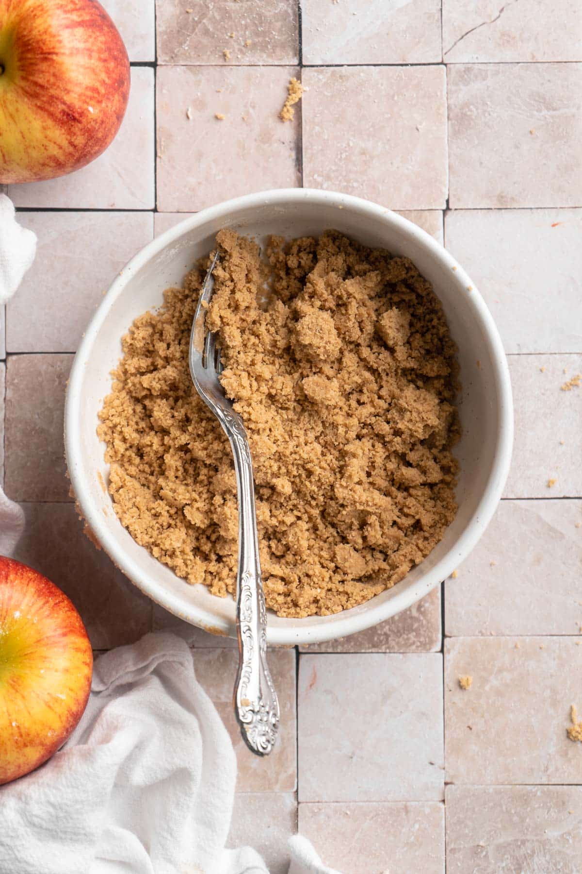 Mixing together brown sugar, flour and butter for the crumb topping.