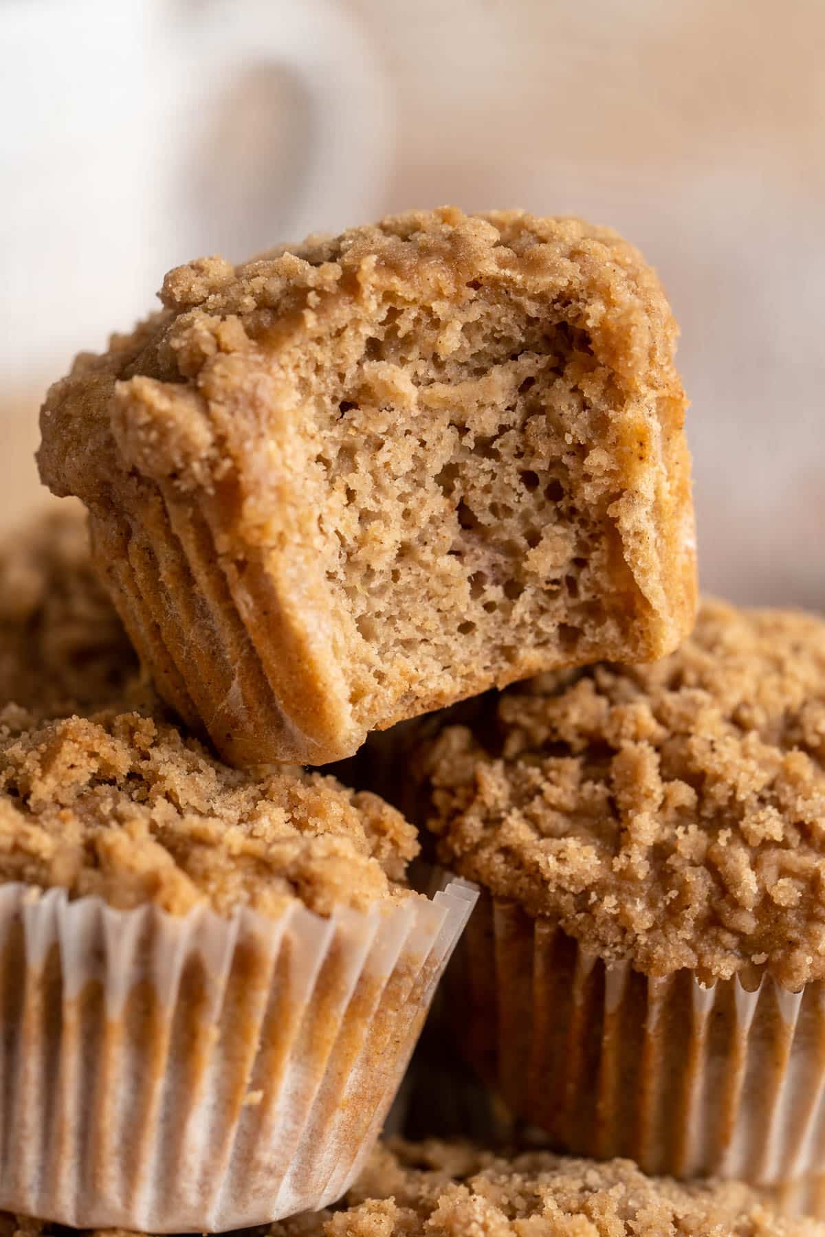 Apple muffins and one that has been bitten into.