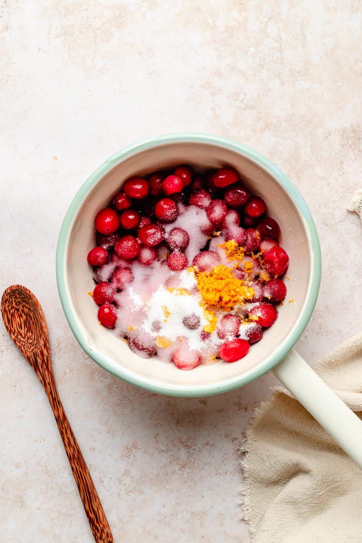 Cranberries, orange zest and stevia in a small pot.