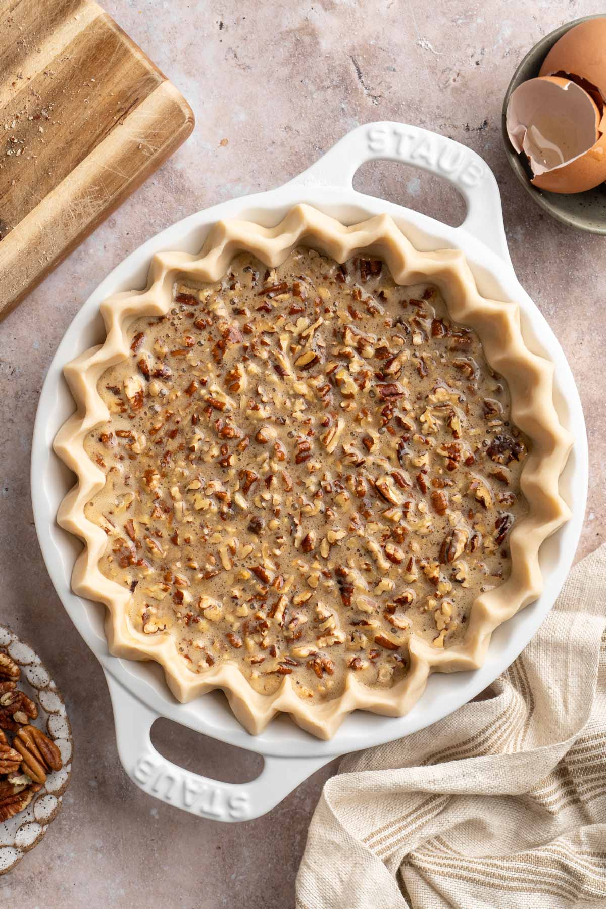 Pecan filling in a pie crust.