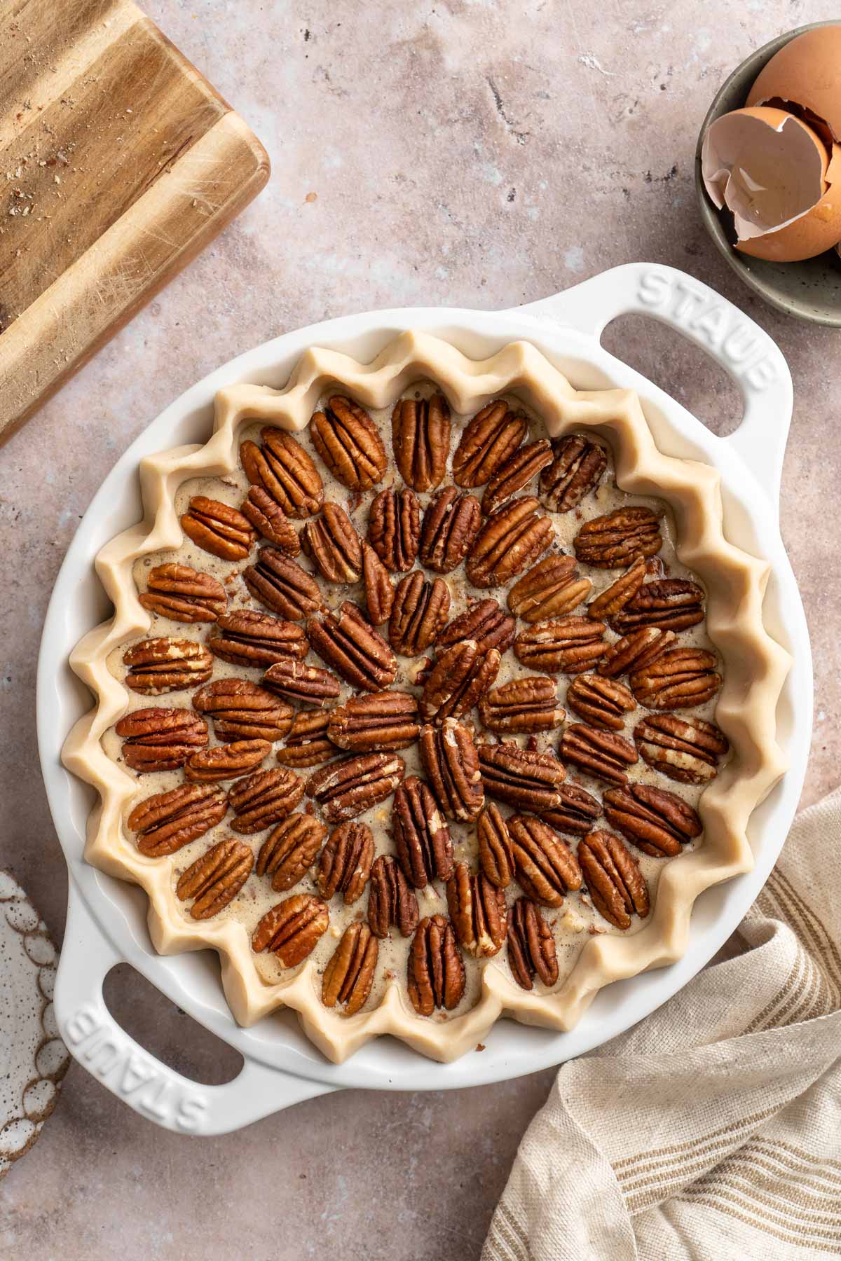 Pecan pie topped with pecan halves.