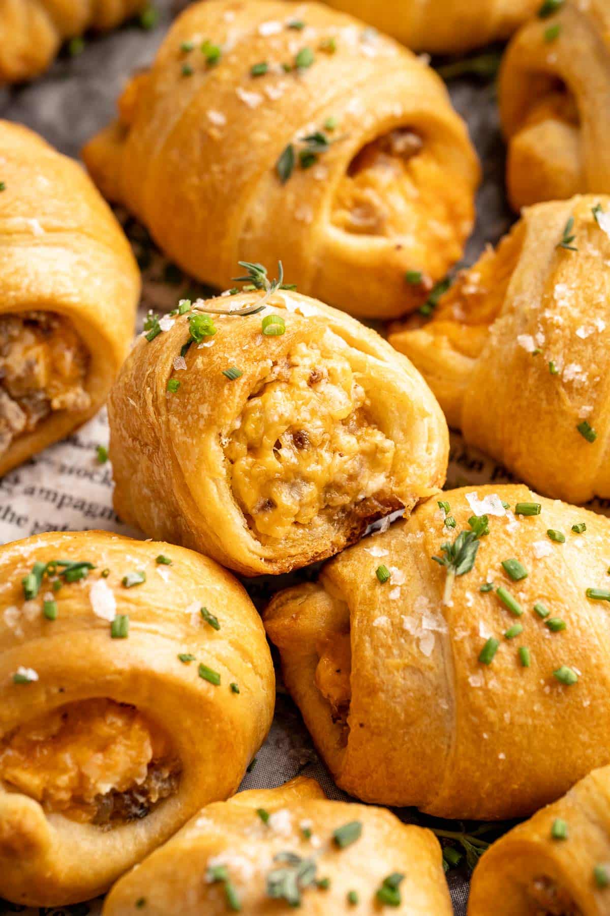 Breakfast crescent rolls stuffed with cheese and breakfast sausage.