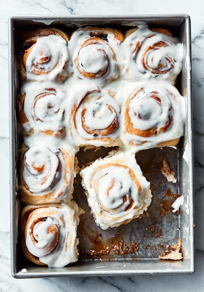 cinnamon rolls cut apart in a pan 