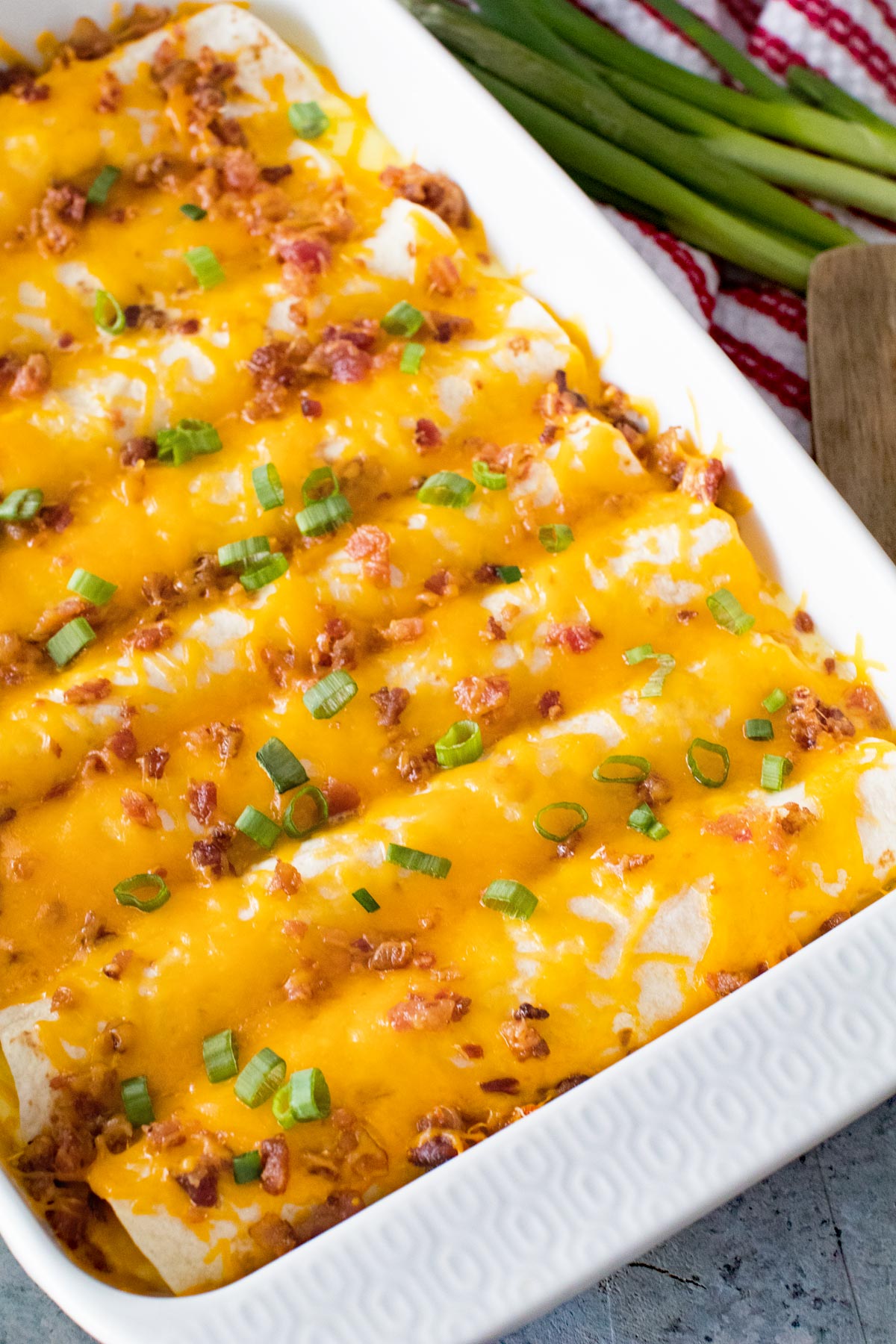 overnight breakfast enchiladas covered in cheese