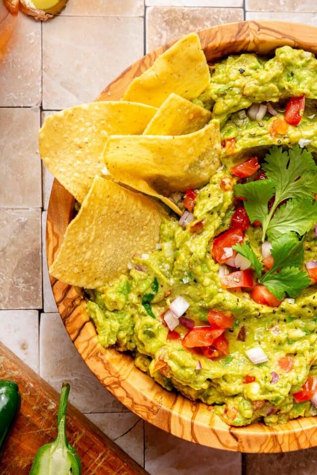 Tortilla chips in guacamole.