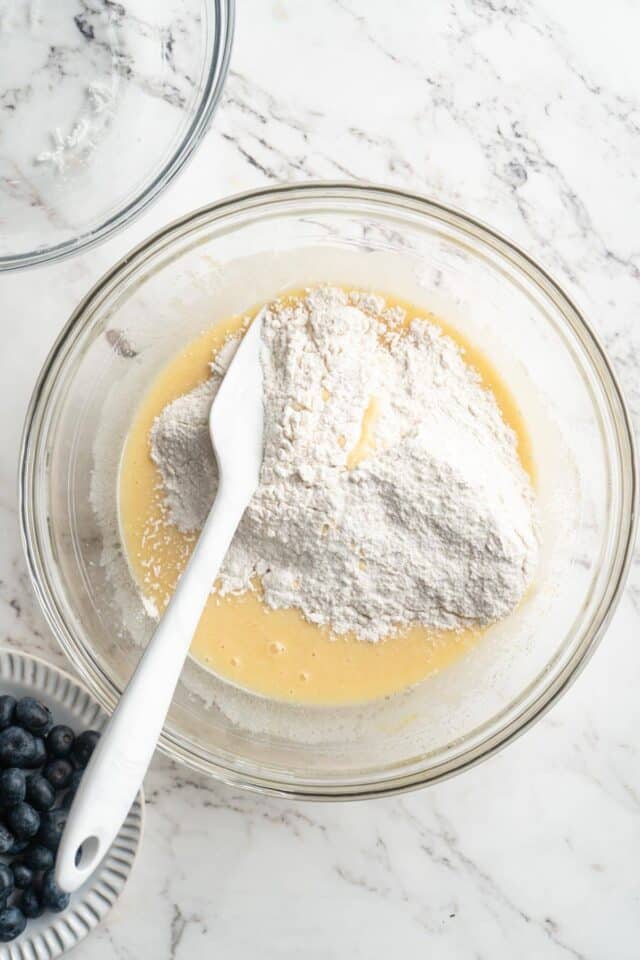 Stirring flour mixture into wet ingredients. 