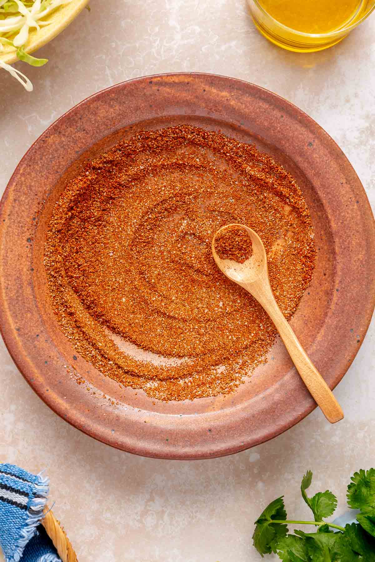 Mixing shrimp spices in a small bowl.