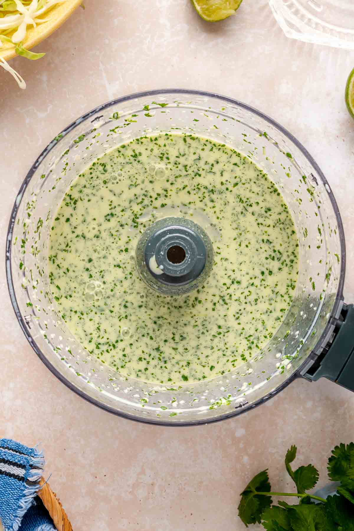 Creamy green sauce in a food processor. 