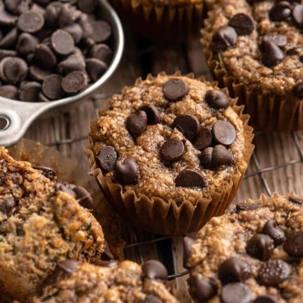 Banana zucchini muffins topped with chocolate chips.