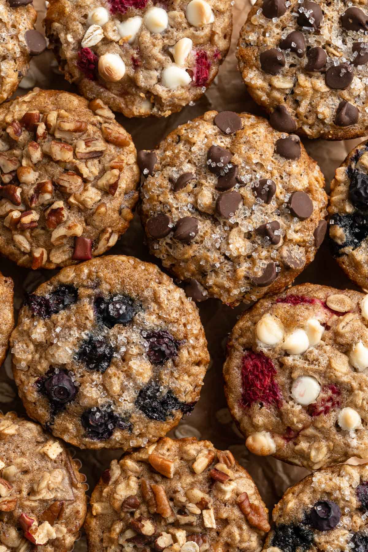 Oatmeal muffins with different mix-ins like blueberries, pecans and chocolate chips.