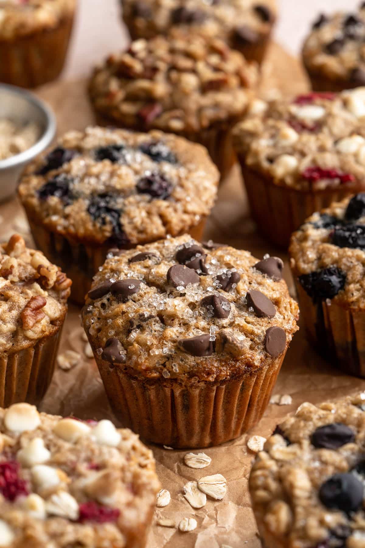 Chocolate chip oatmeal muffin near other types of oatmeal muffins.