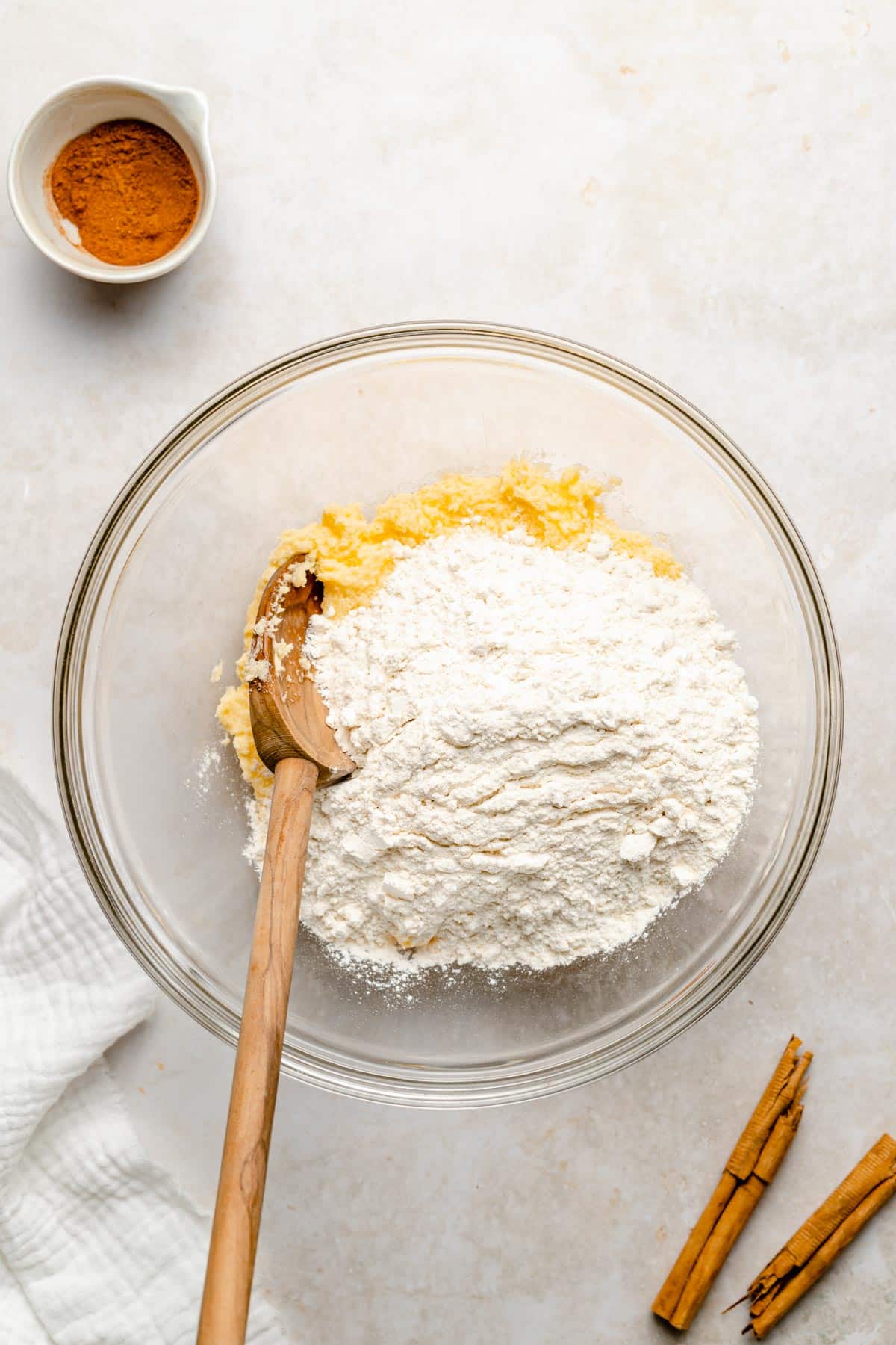 adding flour mixture to sugar mixture