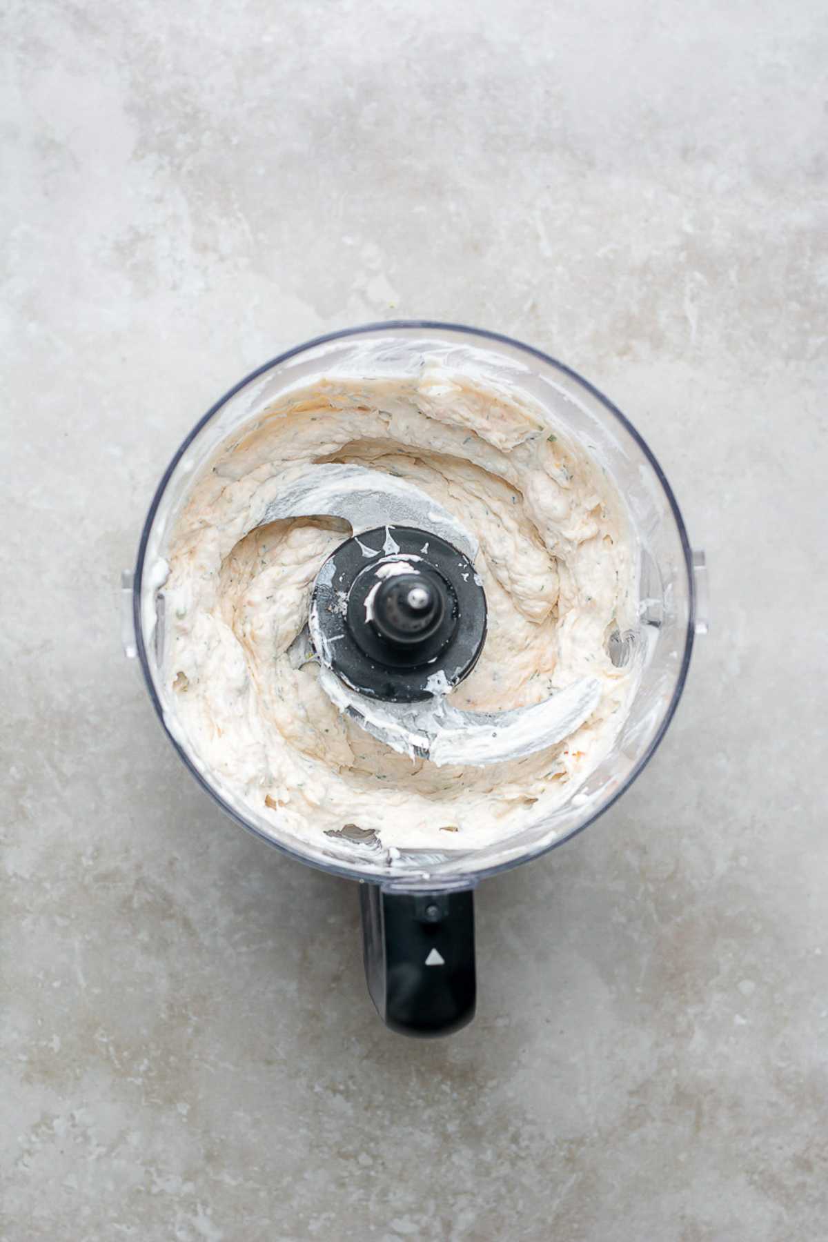 Creamy dip mixed in a food processor.