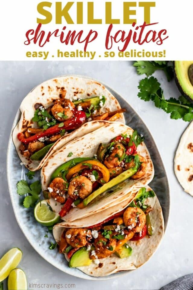 shrimp fajitas served with avocado and lime