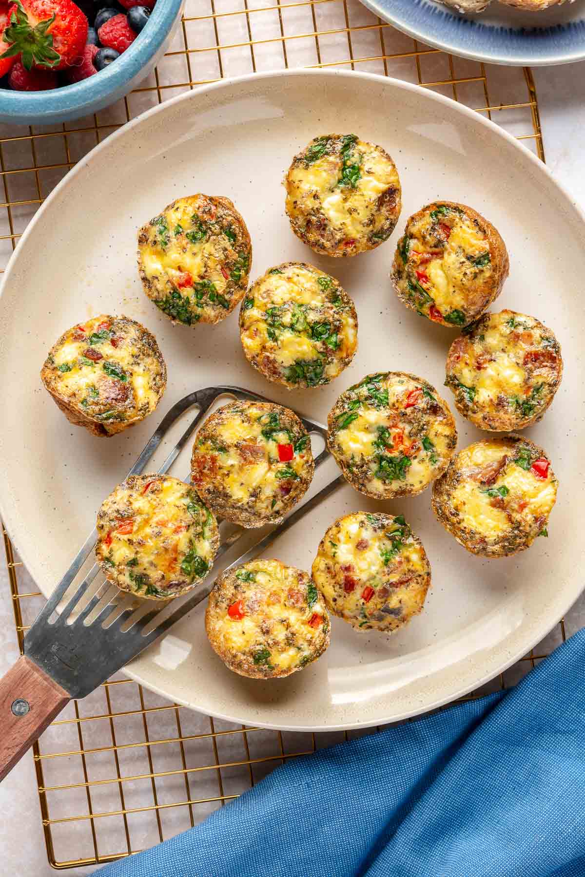 Egg muffin cups on a white plate.