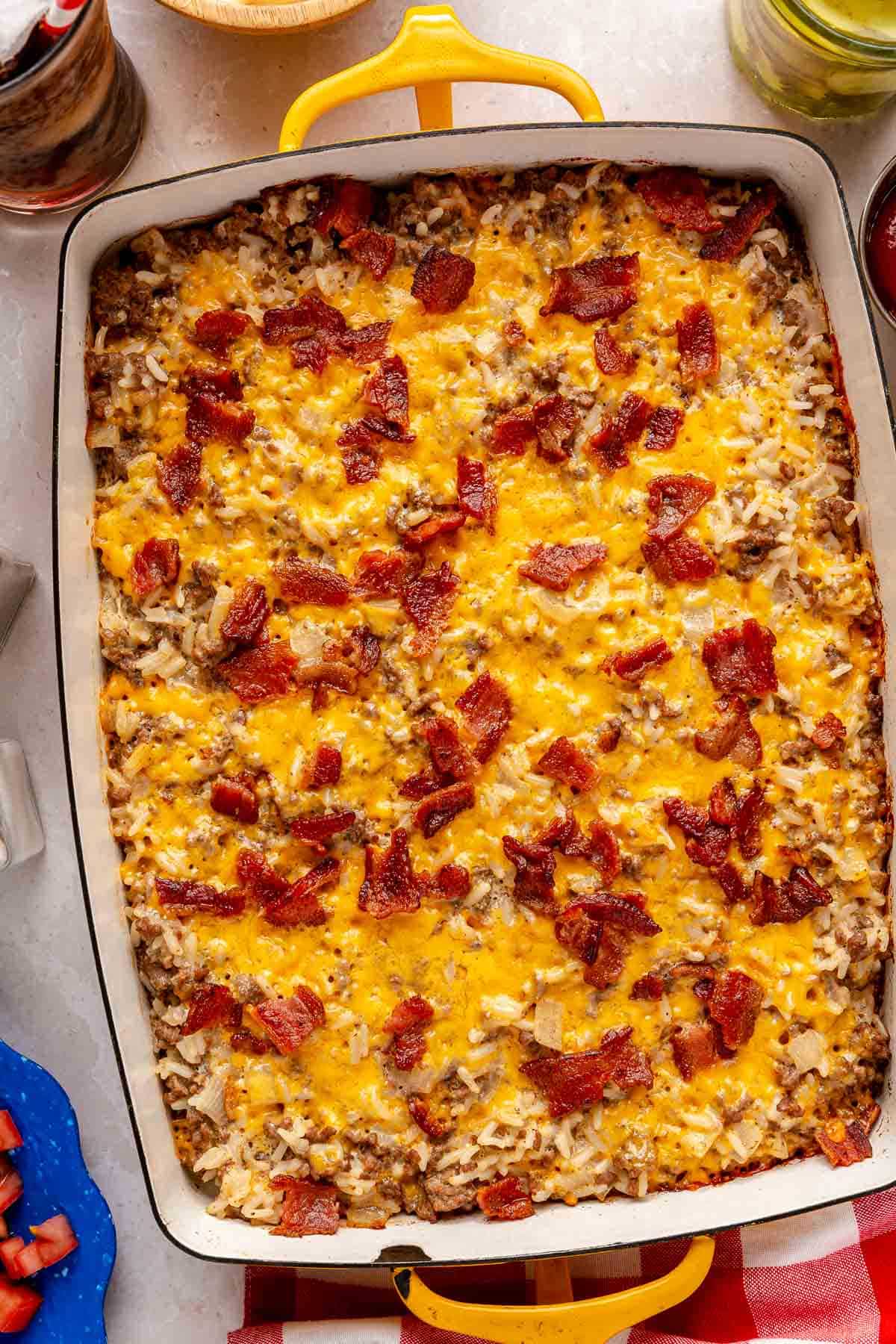 Cheeseburger casserole topped with bacon.