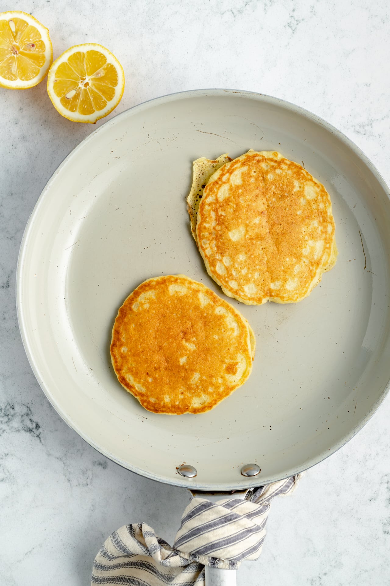 cooking pancakes on a large skillet