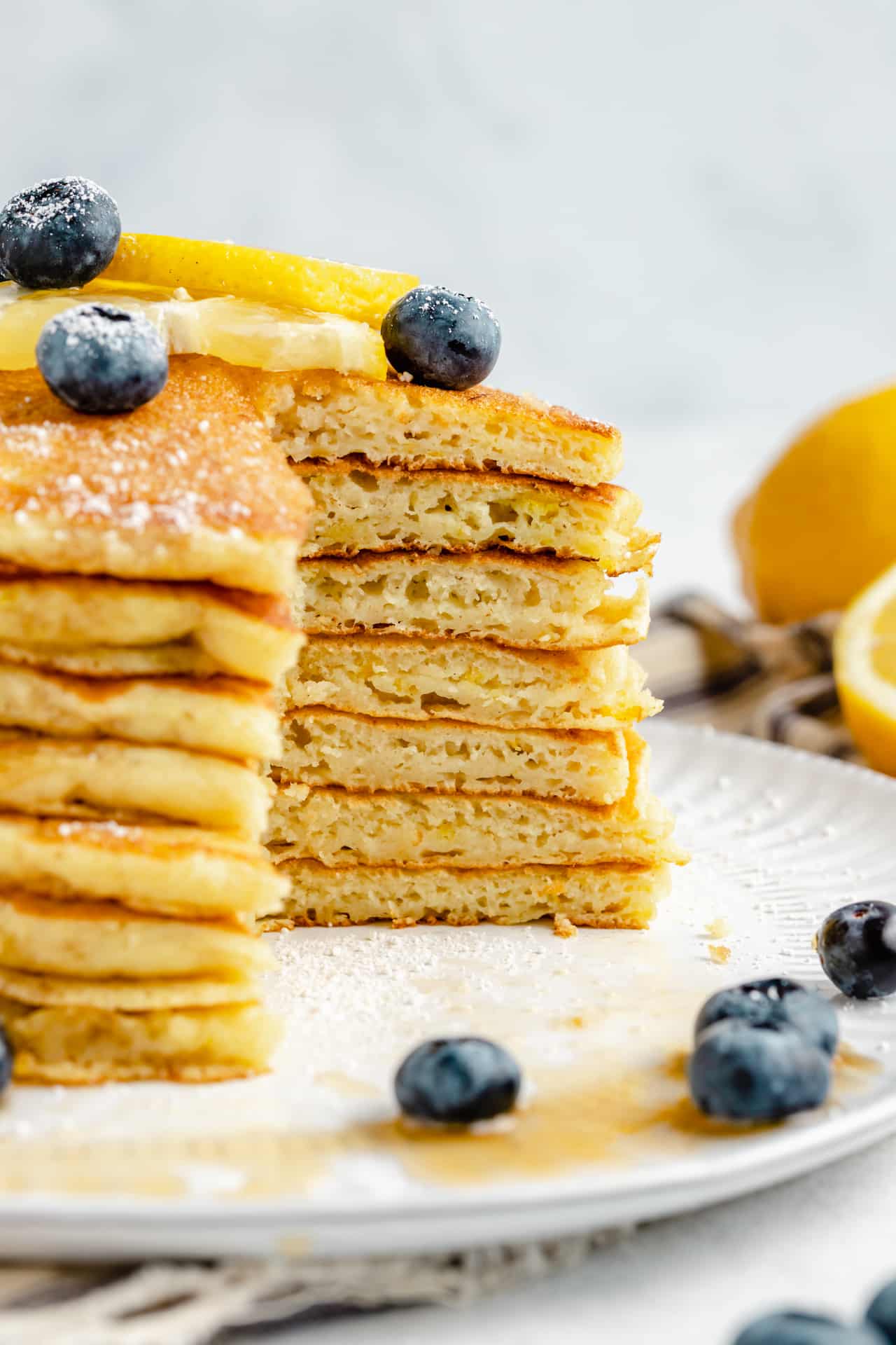 large stack of lemon ricotta pancakes that have been cut into