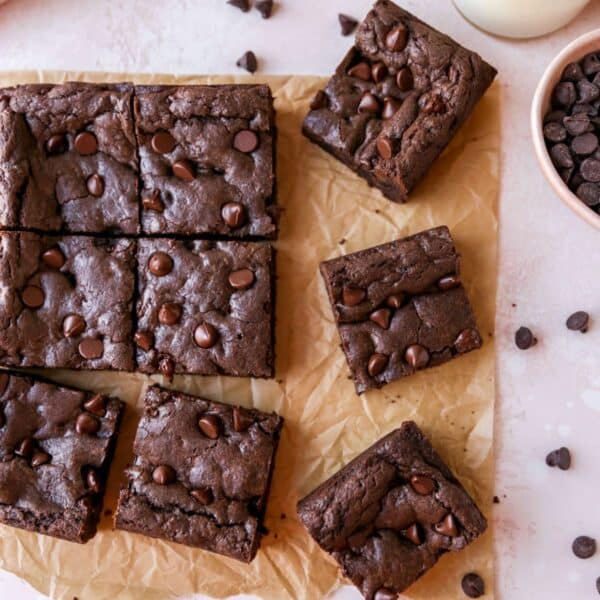 Cake mix brownies cut into bars on parchment paper.