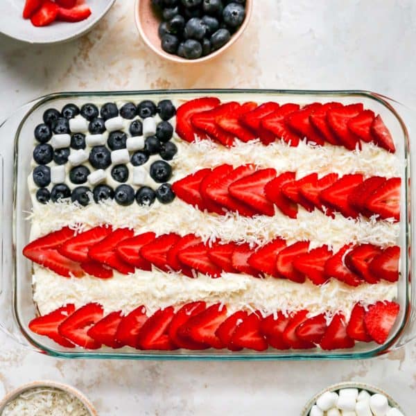 flag cake decorated with strawberries and blueberries