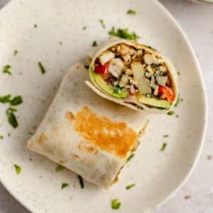 Healthy breakfast burritos filled with sausage and potatoes.