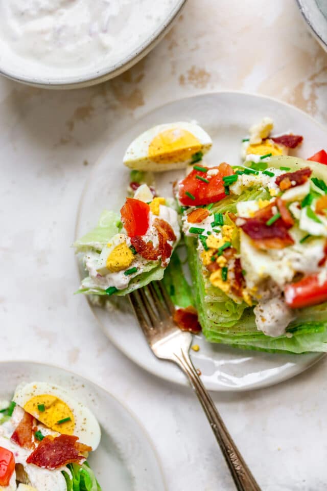 fork taking a bite out of a wedge salad