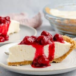 Cream cheese pie topped with cherry pie filling.