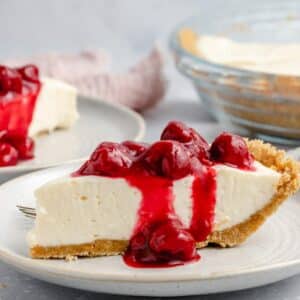 Cream cheese pie topped with cherry pie filling.